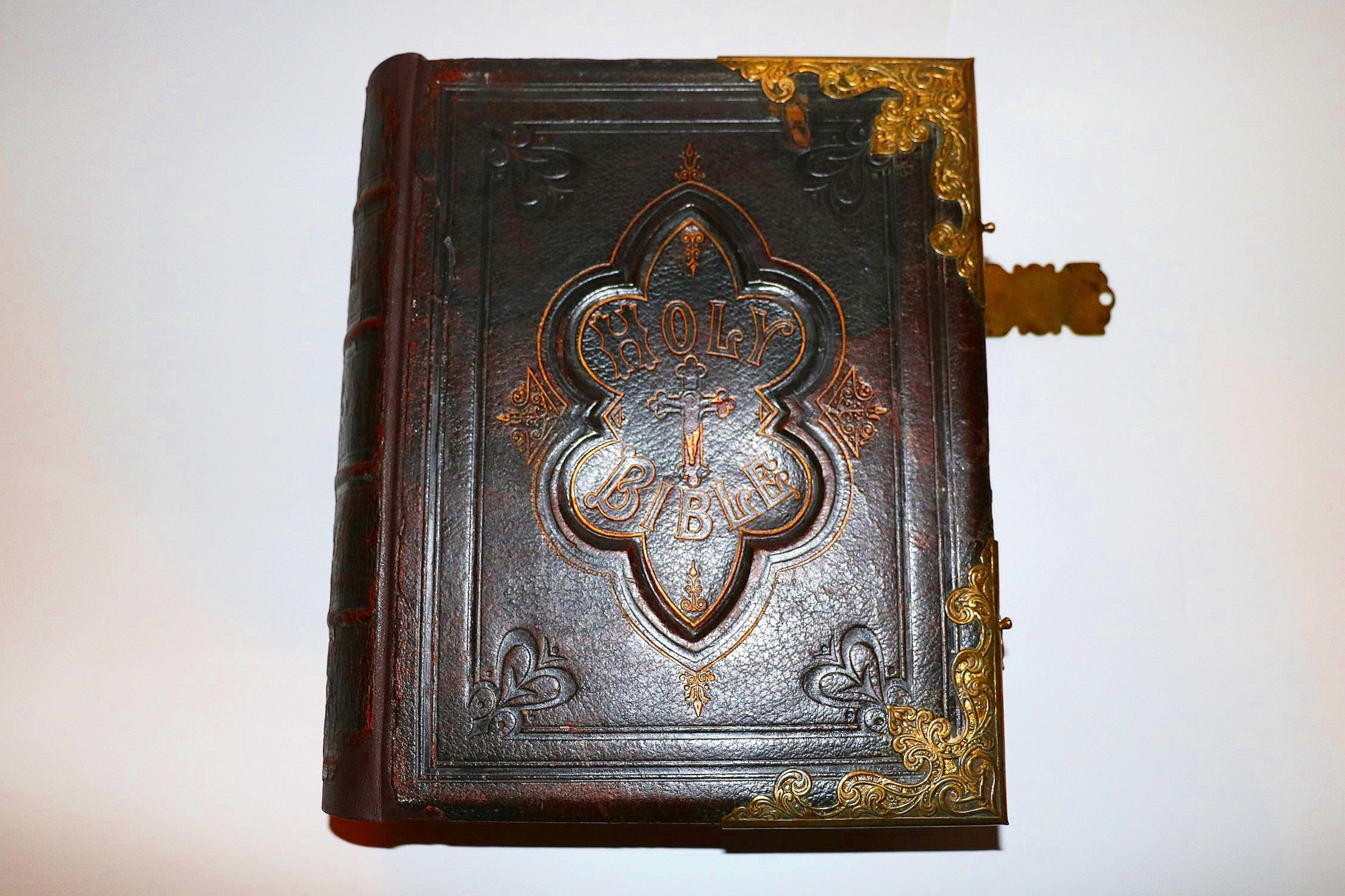 Repaired old bible with gold clasps