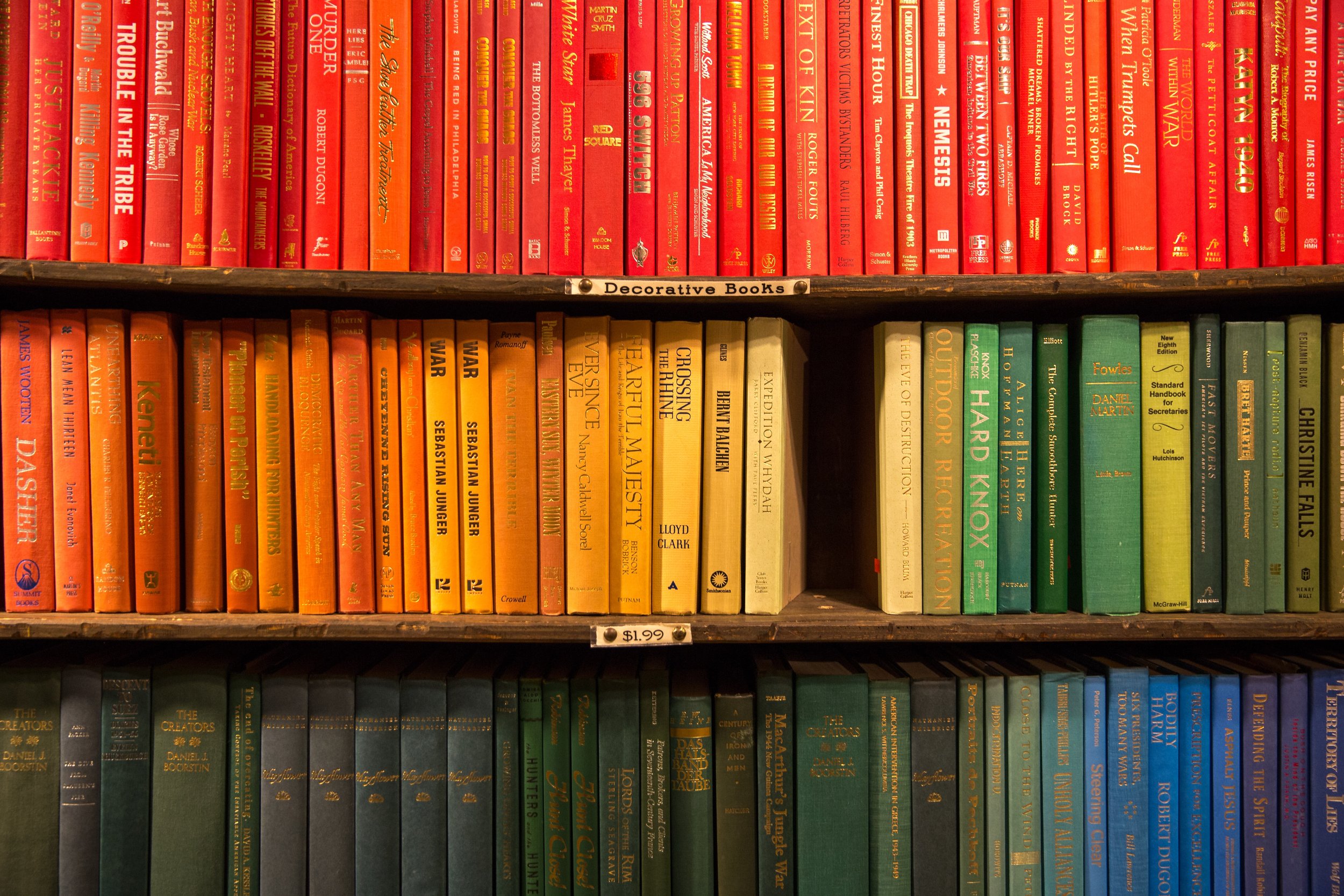 Colour arranged books on shelf